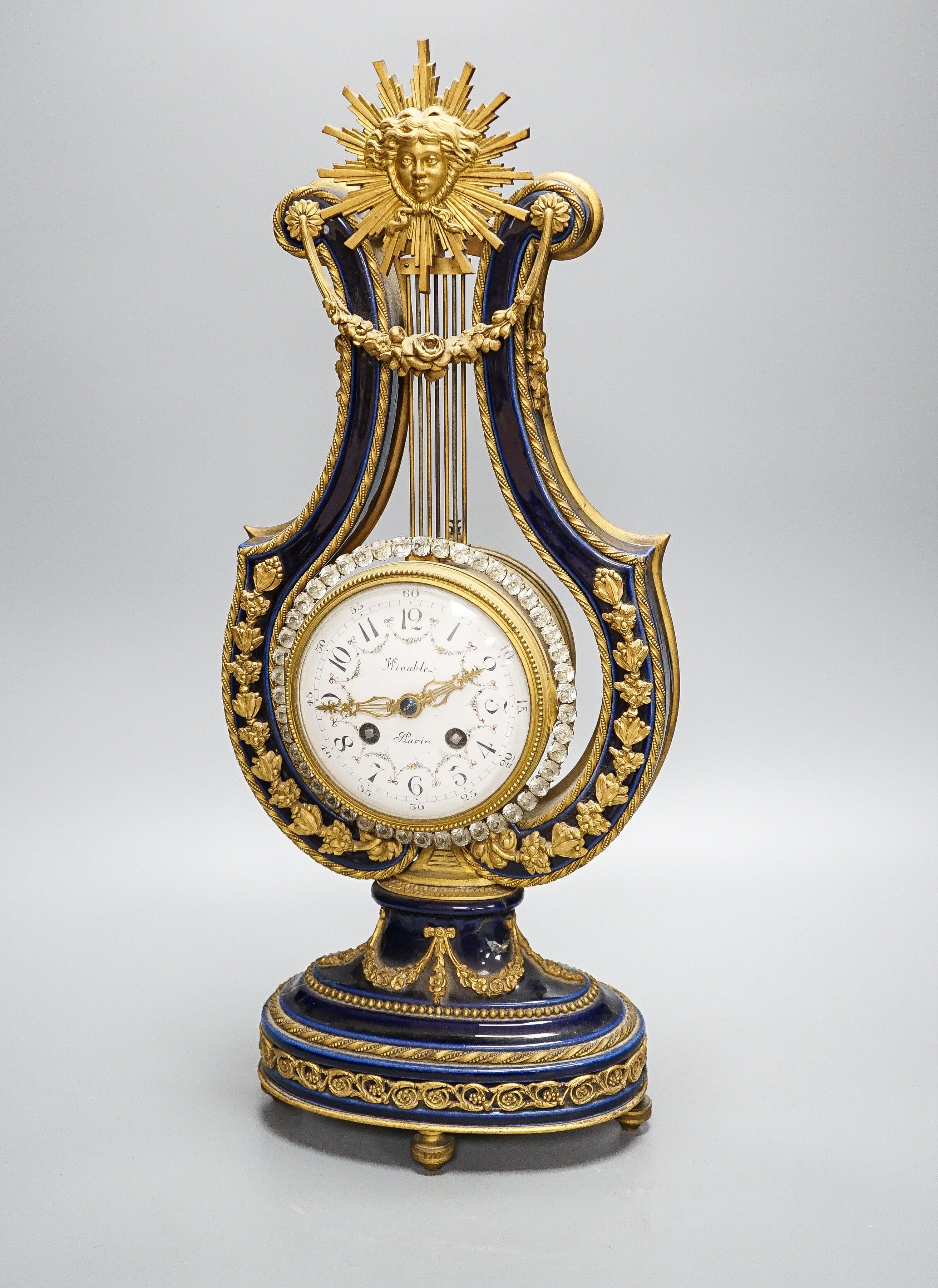 A Louis XV style ormolu mounted blue glazed porcelain lyre-shaped mantel clock (AF) 49cm, paste set surround to the pendulum